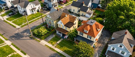 A residential area with houses, streets, and greenery.