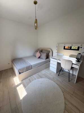 A bedroom with a bed, a desk, a chair, and a round rug. - A Haven of Peace in the South C1S (Vernègues)
