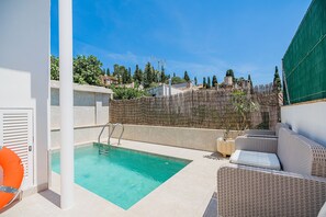 A rooftop pool area with a clear view of the surrounding landscape, including trees and buildings. - Pollensa Villa With Private Pool (Pollença)