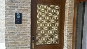 A wooden door with a glass panel and a metal handle. - Shams Boutique Hotel (Bukhara)