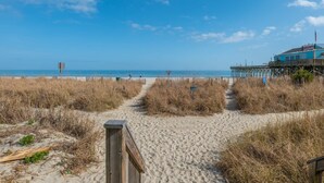 A beach path leading to a pier with a building on it. - Yachtsman S503B Studio (Myrtle Beach)