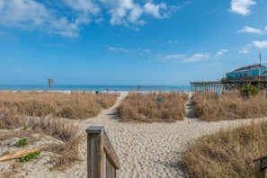 A beach path leading to a pier with a building on it. - Yachtsman S503B Studio (Myrtle Beach)