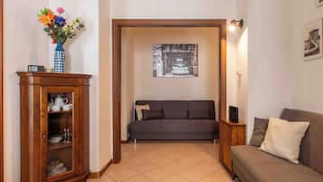 Apartment (1 Bedroom) | Living area | 32-inch Smart TV with cable channels