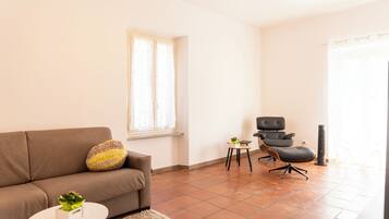 Apartment (1 Bedroom) | Living area | 32-inch Smart TV with cable channels