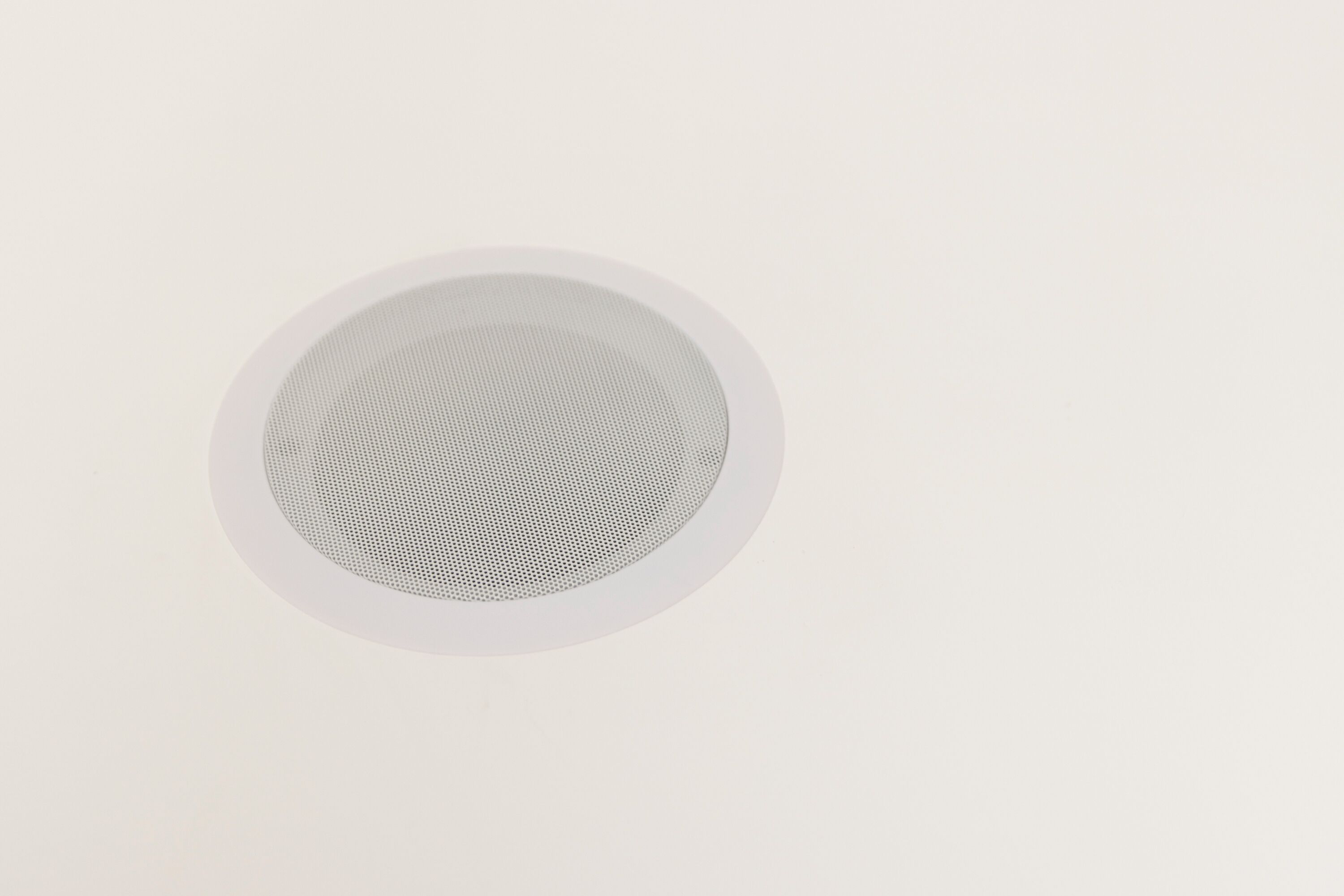 A circular ceiling vent.