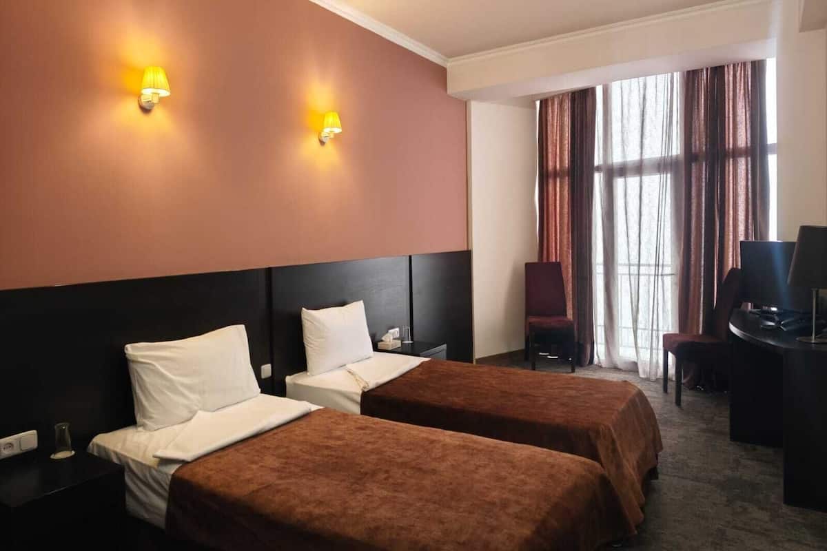 Twin Room, City View | In-room safe, iron/ironing board (on request), free WiFi