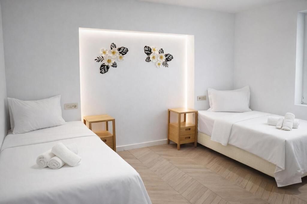 Deluxe Twin Room | Peralatan tempat tidur premium, gebar bulu kapas, tilam berlapik 