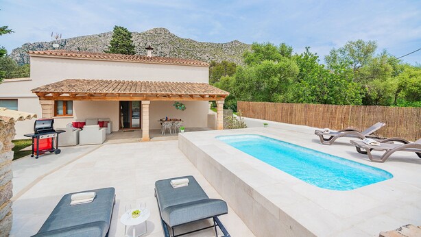 A residential property with a swimming pool, outdoor seating, and a barbecue area. - Cosy 2-bed Villa With Pool, Pollenca (Pollença)
