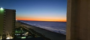 A coastal view with a building adjacent to the beach. - Sea Mist 51012 Ocean View Escape (Myrtle Beach)