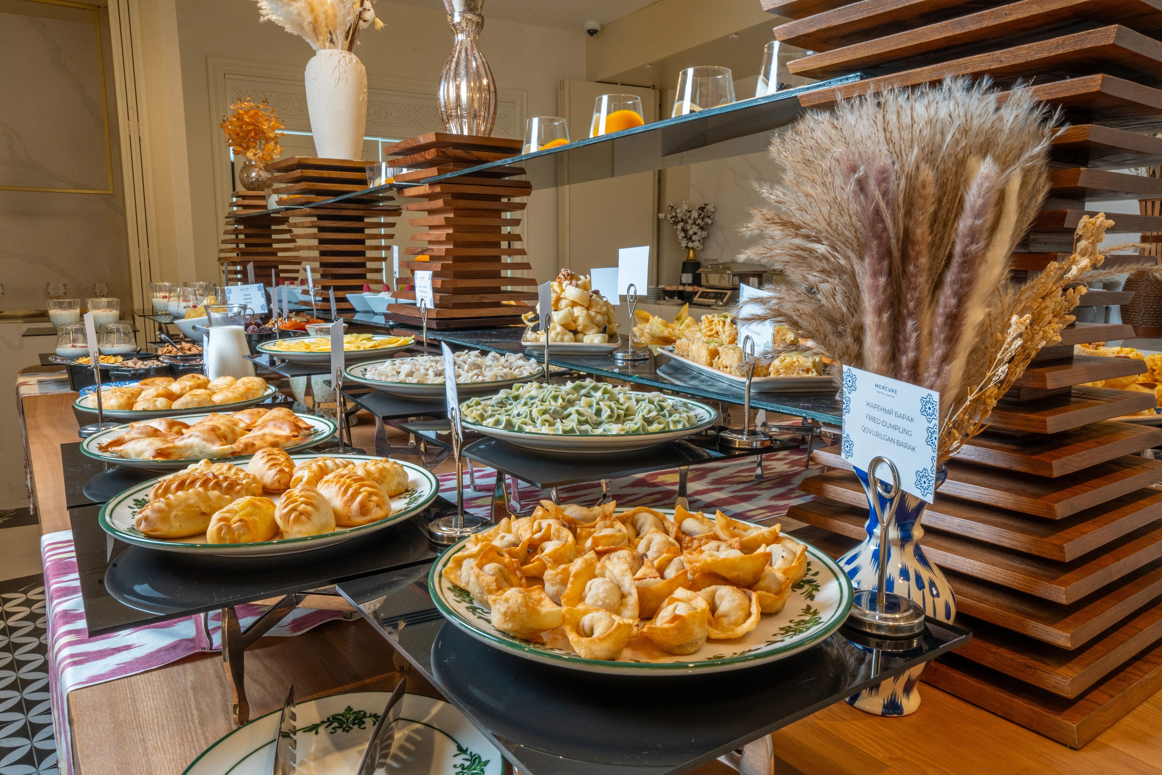 A buffet with various food options including pastries, salads, and a variety of dishes.