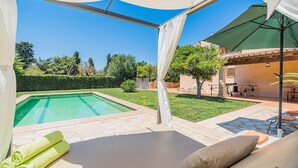 A poolside area with a covered seating area, a pool, and a view of the surrounding landscape. - Private Pool Villa in Pollensa (Pollença)