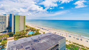 A hotel with a pool area and a beach view. - Sea Mist 51202 Cozy Ocean View Studio (Myrtle Beach)
