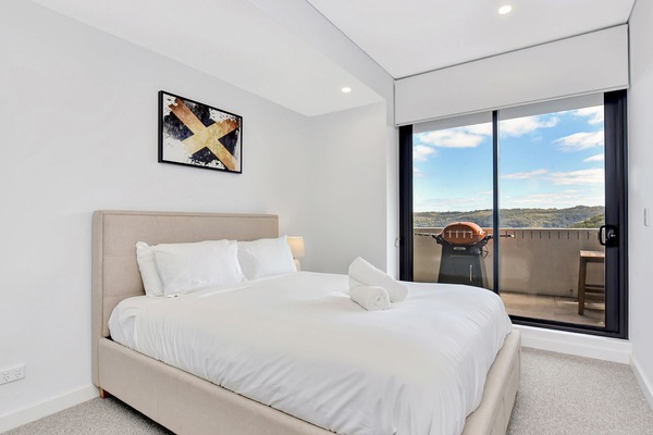 Comfortable bedroom with picturesque outlook.