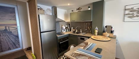Coffee/tea maker, fridge, microwave, oven