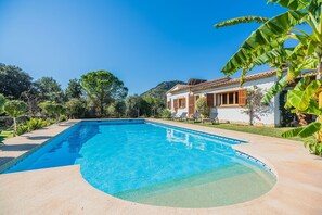 A rectangular swimming pool with clear blue water, surrounded by a concrete deck. - Contemporary Mallorcan Villa for 6 (Pollença)