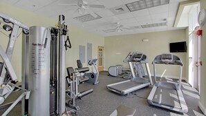 A gym with treadmills, elliptical machines, and weight equipment. - Ariel Dunes I 1506 | Gulf Views • Resort Pools • Steps to the Beach (Miramar Beach)