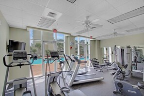 A gym with treadmills, elliptical machines, and free weights. - Ariel Dunes I 1506 | Gulf Views • Resort Pools • Steps to the Beach (Miramar Beach)