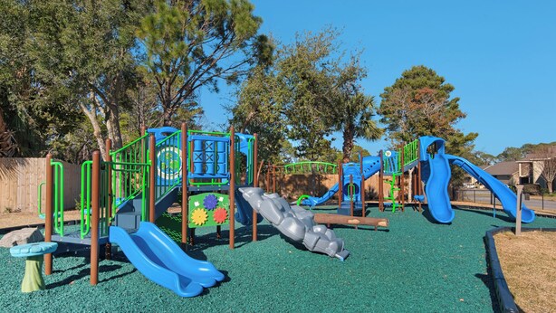 A playground with multiple slides and climbing structures. - Ariel Dunes I 1506 | Gulf Views • Resort Pools • Steps to the Beach (Miramar Beach)