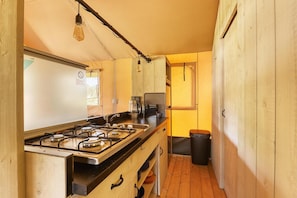 Coffee/tea maker, fridge, cookware/dishes/utensils