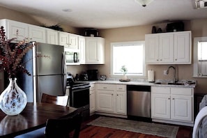 Coffee/tea maker, microwave, dishwasher, cookware/dishes/utensils