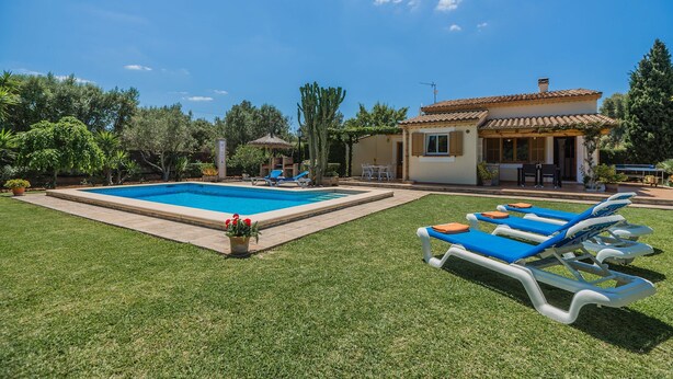 A residential property with a swimming pool, lounge chairs, and a patio area. - Countryside Villa in Pollensa (Pollença)