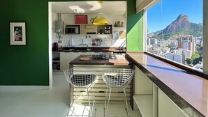 A modern kitchen with a view of a cityscape and a mountain. - Apartment in Leblon, Rio de Janeiro!
Best neighborhood, 2 blocks from the beach. (Rio de Janeiro)
