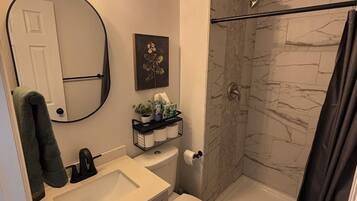 Shower, towels, soap, toilet paper