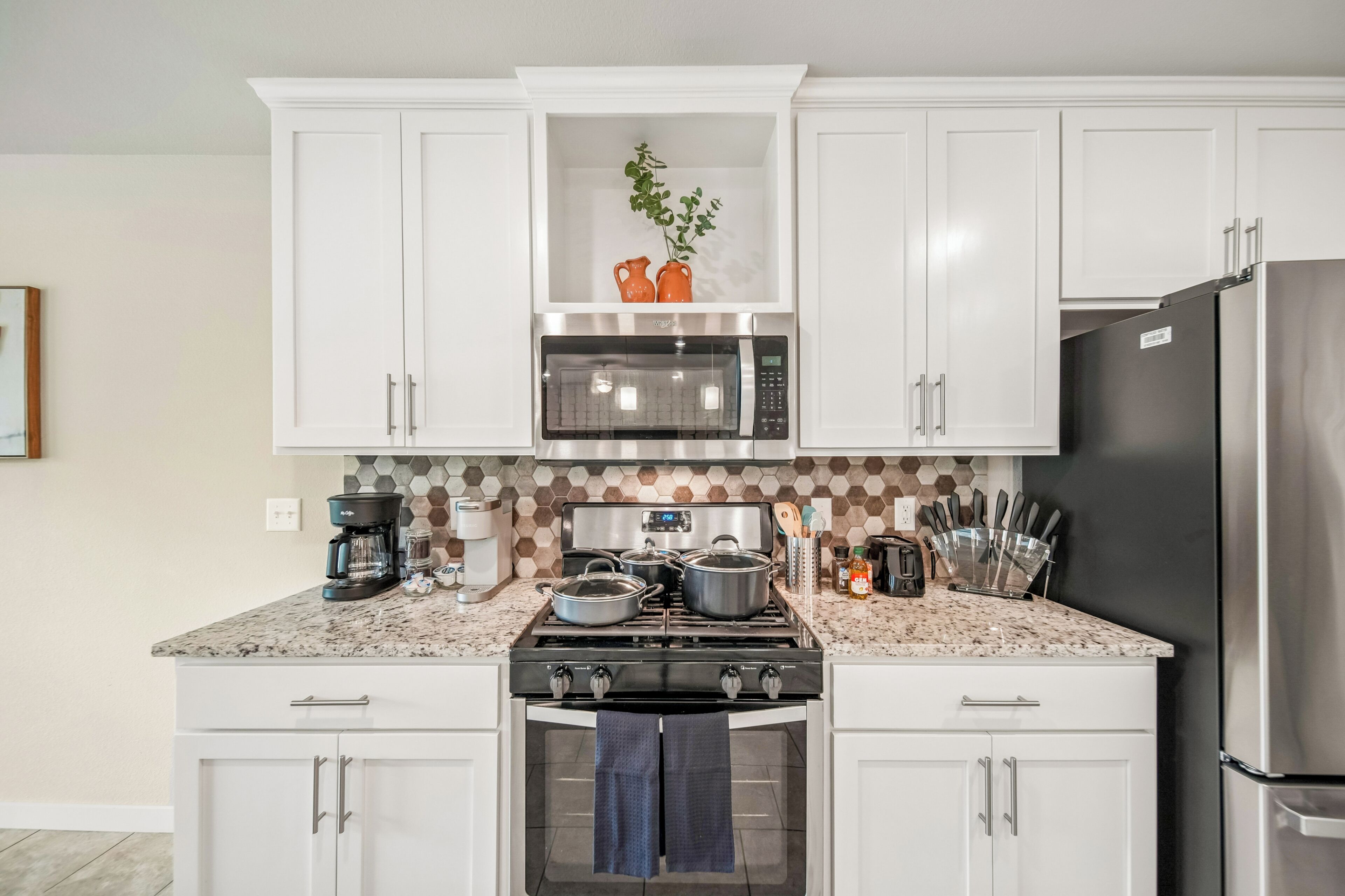 Coffee/tea maker, fridge, microwave, oven
