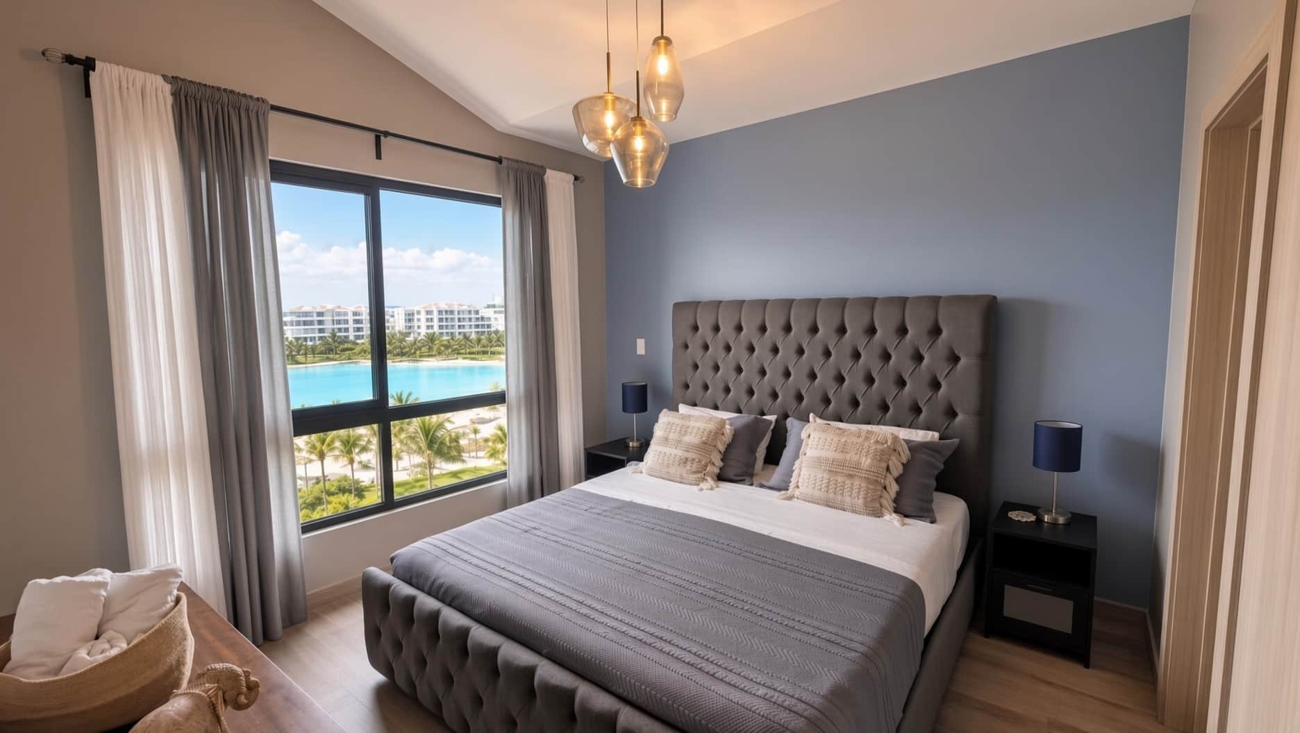 A bedroom with a large bed, a view of a swimming pool, and a modern chandelier.