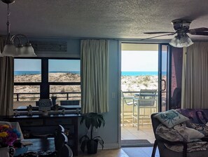 A room with a view of the beach, a ceiling fan, a dining area, and a sofa. - Spacious 3Bedroom ground floor Condo perfect for big familyFort Walton Beach (Fort Walton Beach)