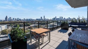 Outdoor dining -     Modern Luxury Skyrise Black & Gold Retreat Midtown (Atlanta)