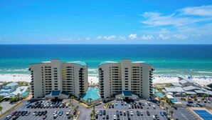 A beachfront hotel with multiple parking lots and a view of the ocean. - 🏖️Gulf Views-5 Pools-Laketown Wharf 1817🏖️ (Panama City Beach)