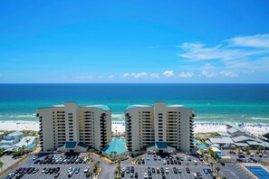 A beachfront hotel with multiple parking lots and a view of the ocean. - 🏖️Gulf Views-5 Pools-Laketown Wharf 1817🏖️ (Panama City Beach)
