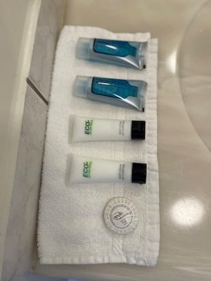 Combined shower/tub, hair dryer, towels, soap