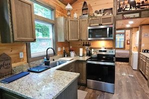 Coffee/tea maker, fridge, microwave, oven
