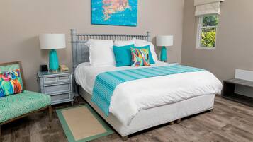 A bedroom with a bed, nightstands, a chair, a window, and a painting on the wall.