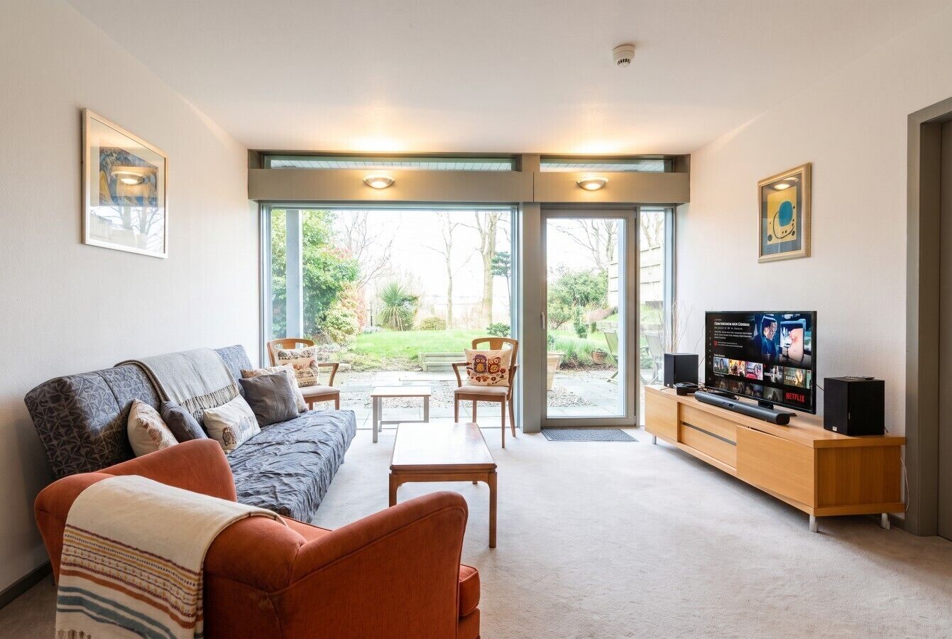 Second lounge with Netflix TV opening onto the garden