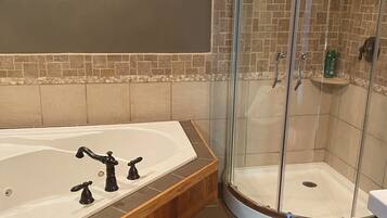 Jetted tub, hair dryer, towels, soap