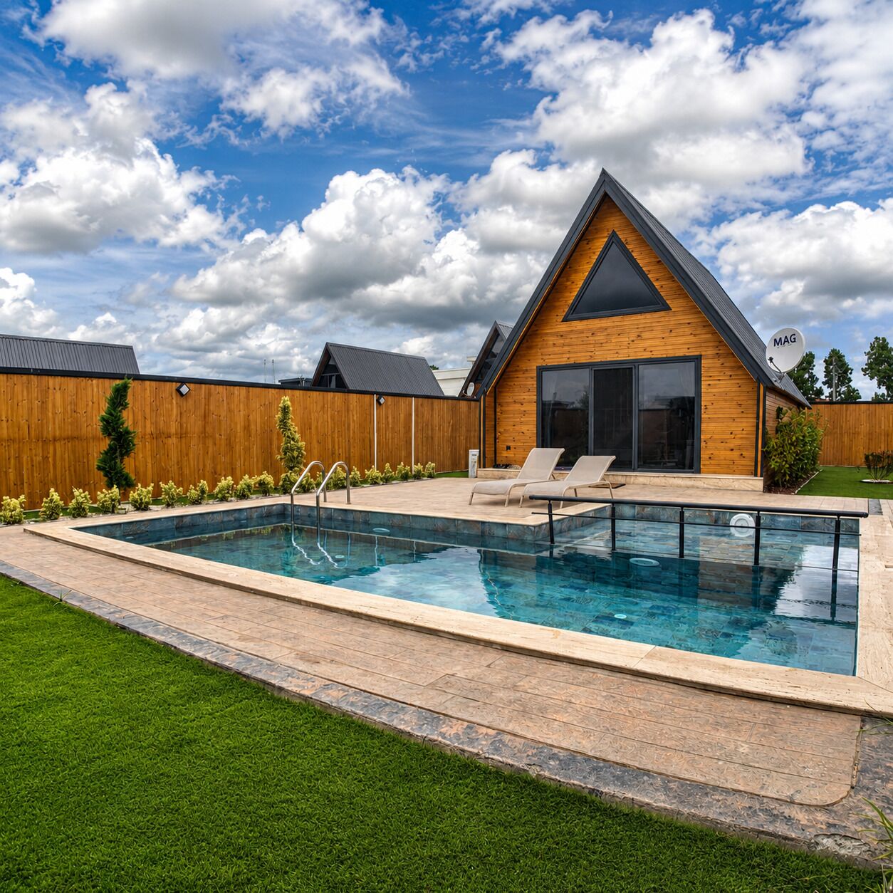 A modern house with a swimming pool, a wooden deck, and a satellite dish.