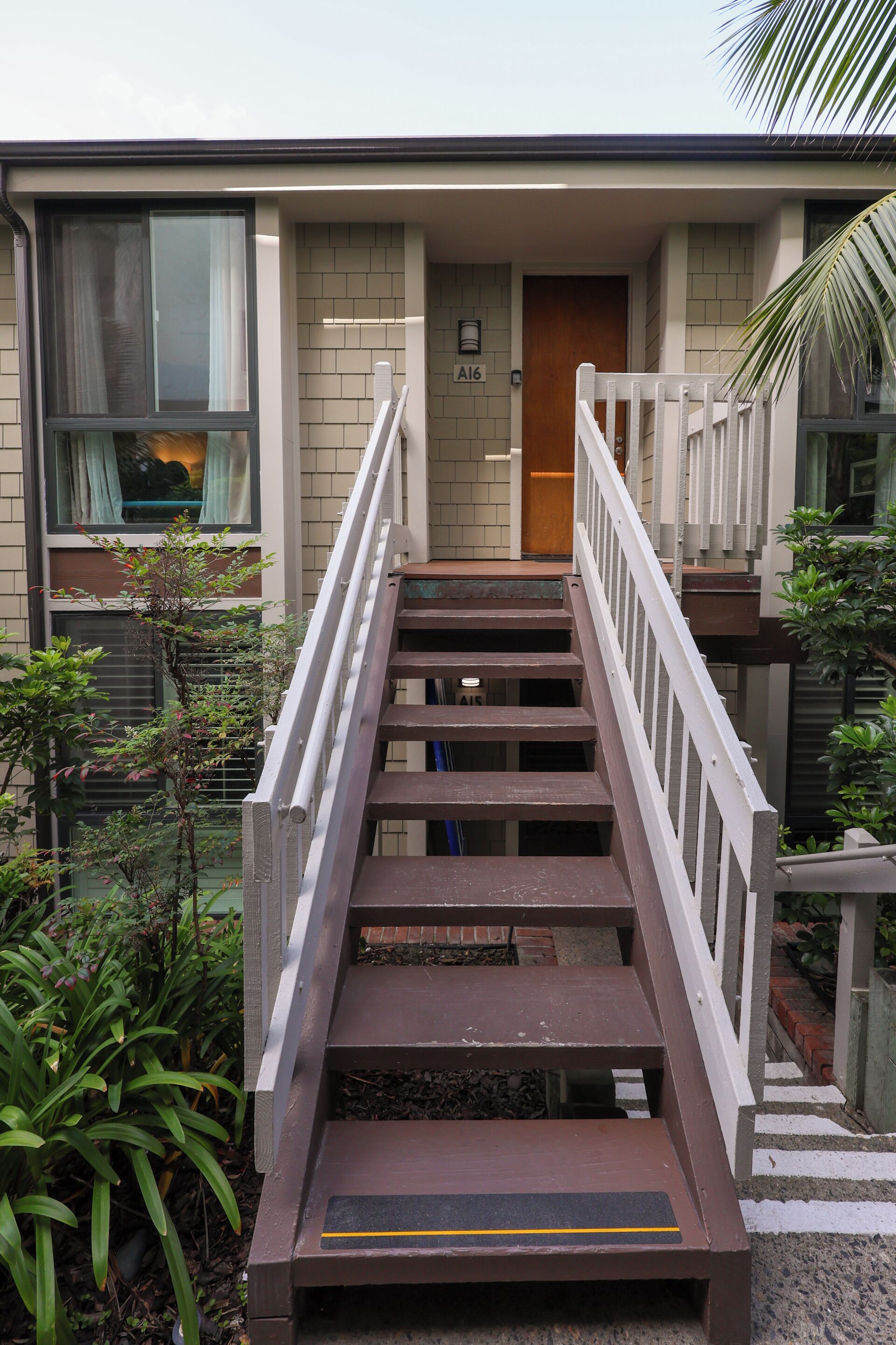 A staircase leading to a building entrance with a door labeled 'A6'.