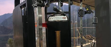 A gym with exercise equipment, including a pull-up bar and a weight bench.