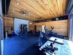 A gym with various exercise equipment, including treadmills and weight machines. - Mack Mountain Lodge (Kirby)