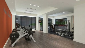 Un gimnasio moderno con máquinas de cardio, equipo de entrenamiento de pesas y amplias ventanas que ofrecen vistas al exterior.