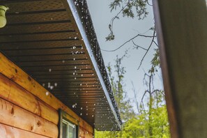 A wooden exterior with a sloped roof and a window. - Falcon Cottage - 2 Bedroom - Family Friendly (Trent Lakes)