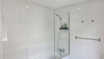 Shower, towels, soap, toilet paper