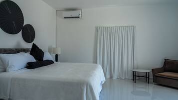 Deluxe Suite, Pool View | In-room safe, iron/ironing board, WiFi (free)
