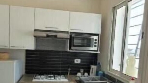 Private kitchen - Beautiful Rooftop Apartment (Monastir)