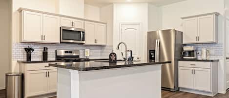 Coffee/tea maker, fridge, microwave, oven