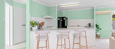 Coffee/tea maker, fridge, microwave, oven