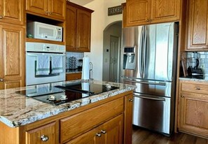 Coffee/tea maker, fridge, microwave, oven